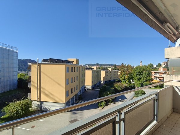 / the view of the city from the balcony of a large apartment