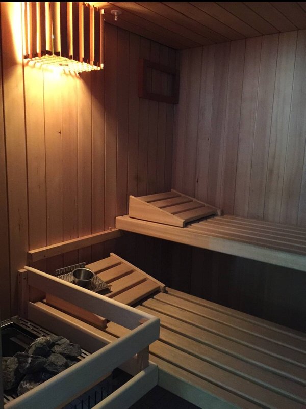 A sleek, modern sauna designed for deep relaxation and total body recharge without ever leaving home.