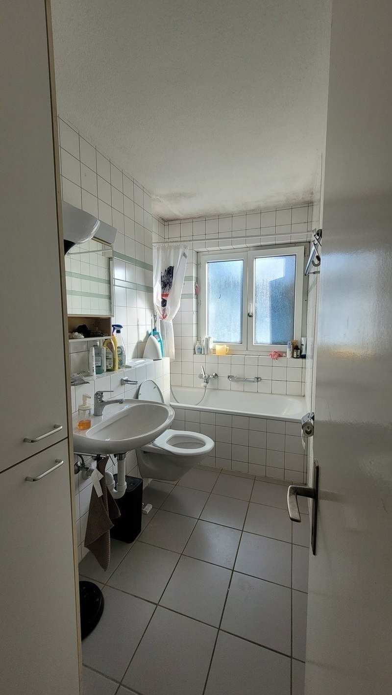 Bathroom. Equipped wtih bathtub, cabinet, and storage.