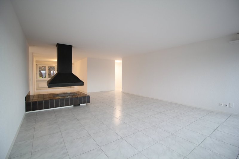 Wohnzimmer mit offenem Cheminée