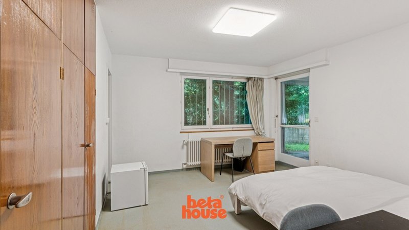 Bedroom with small Fridge